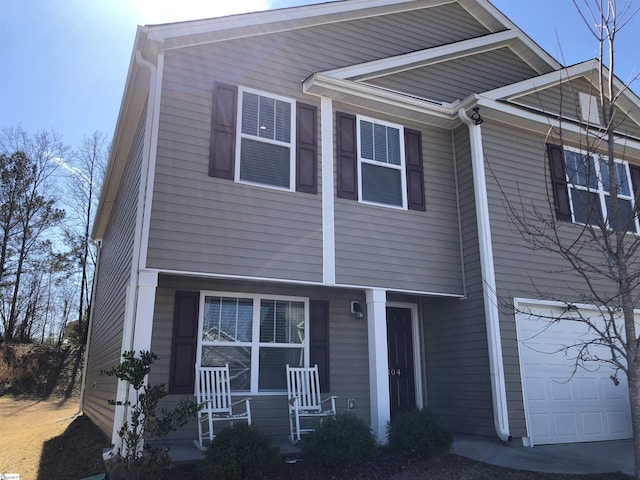 view of front facade featuring a garage and covered porch