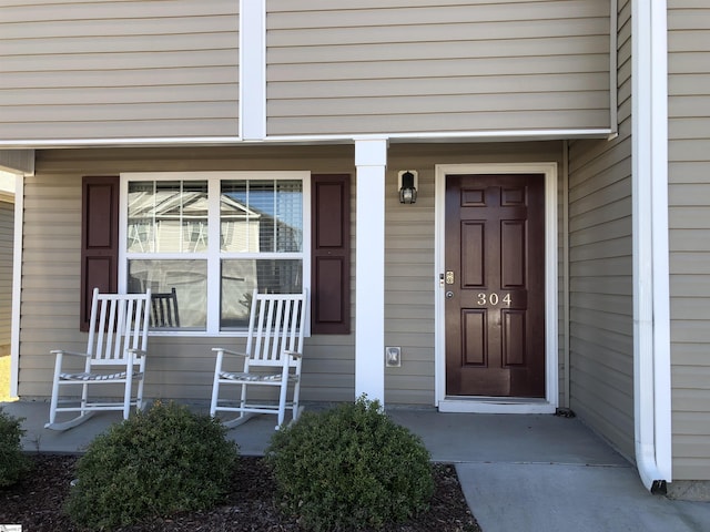 property entrance featuring covered porch