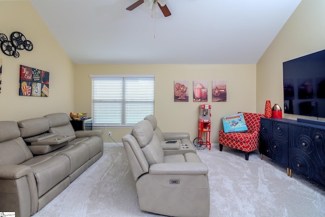 carpeted living area featuring lofted ceiling and a ceiling fan