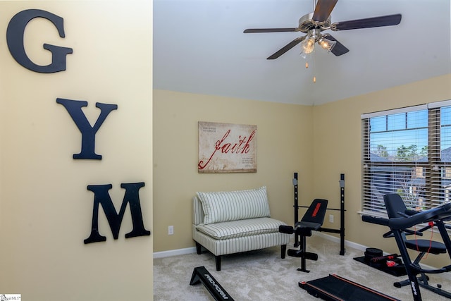 exercise area with carpet, vaulted ceiling, baseboards, and ceiling fan