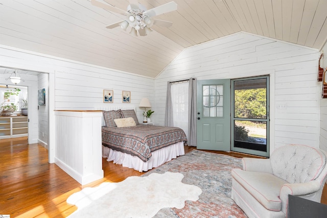 bedroom with wood ceiling, multiple windows, vaulted ceiling, and wood finished floors