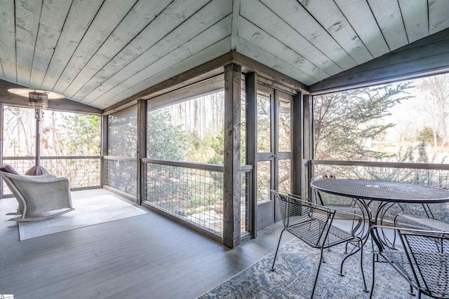 sunroom featuring wood ceiling and vaulted ceiling