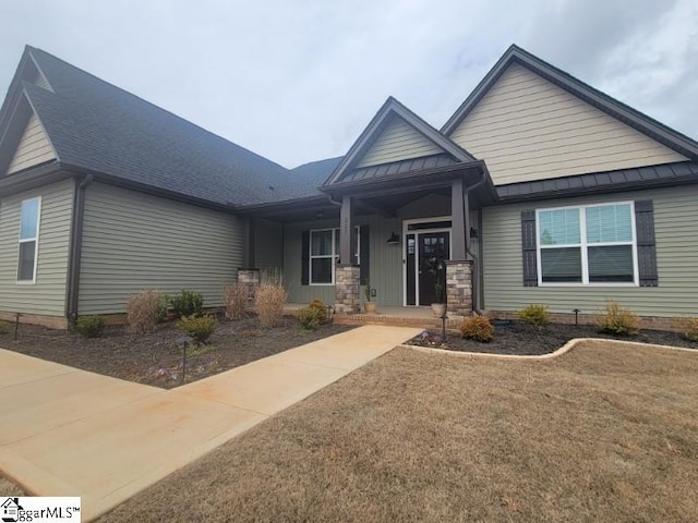 view of front facade with a standing seam roof and metal roof