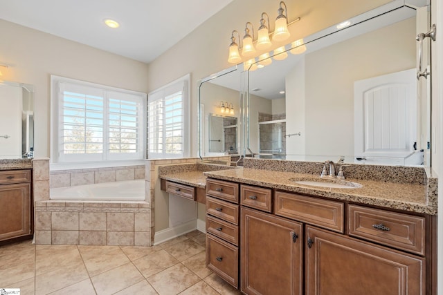 full bath with tile patterned flooring, a garden tub, a shower stall, and vanity