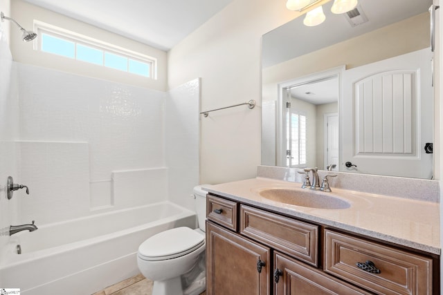 bathroom with visible vents, plenty of natural light, vanity, and toilet