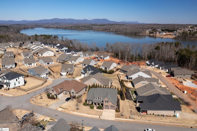 bird's eye view featuring a residential view and a water and mountain view