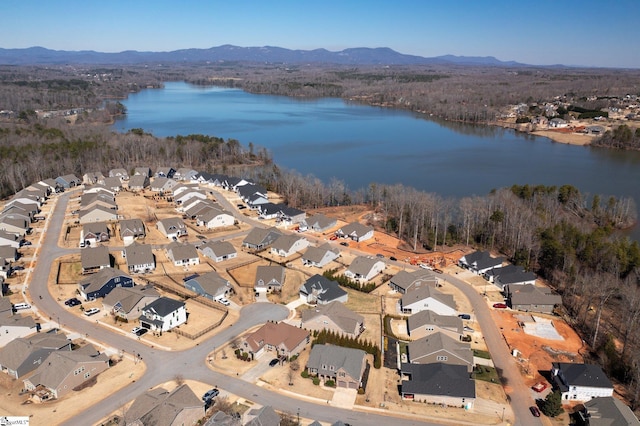 bird's eye view featuring a residential view and a water and mountain view