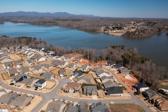 bird's eye view featuring a water and mountain view and a residential view