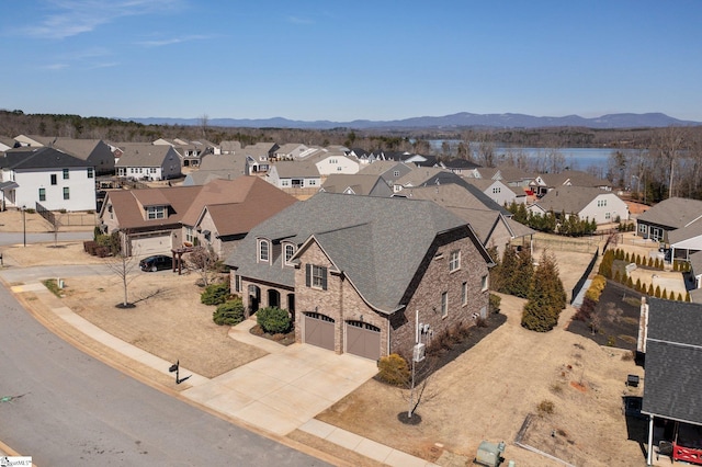 birds eye view of property with a residential view and a mountain view