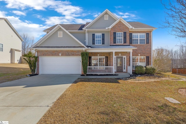 view of front facade featuring a garage, brick siding, concrete driveway, covered porch, and a front yard