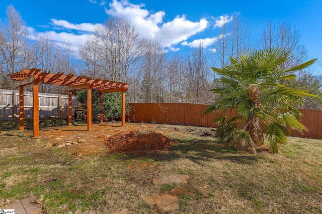 view of yard featuring a fenced backyard and a pergola