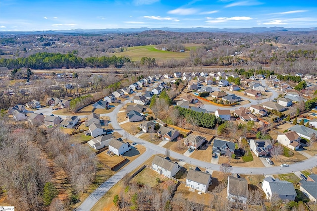 birds eye view of property with a residential view and a mountain view