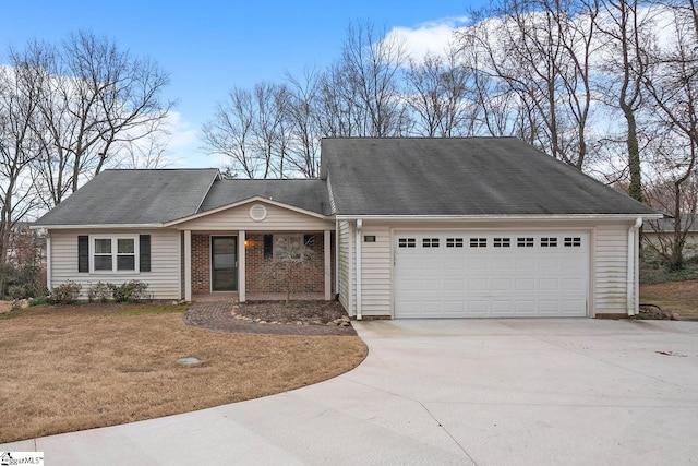 view of front facade featuring a garage, brick siding, driveway, and a front lawn