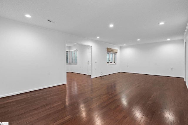 unfurnished room with recessed lighting, visible vents, baseboards, and hardwood / wood-style flooring