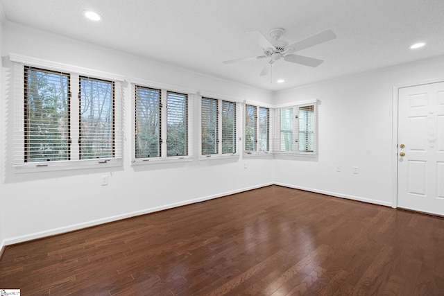 unfurnished sunroom featuring a healthy amount of sunlight and ceiling fan