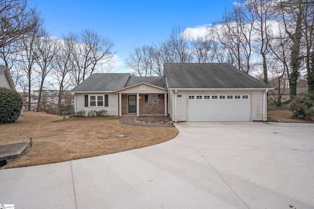 ranch-style home featuring a front lawn, brick siding, driveway, and an attached garage