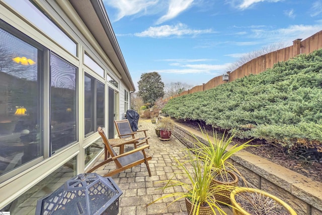 view of patio / terrace featuring fence