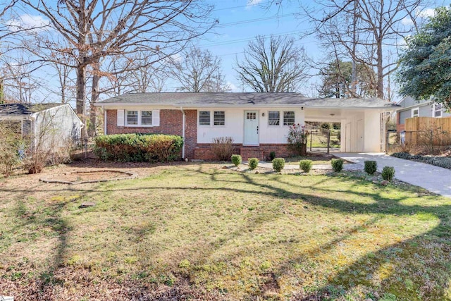 ranch-style house featuring brick siding, fence, driveway, a carport, and a front lawn