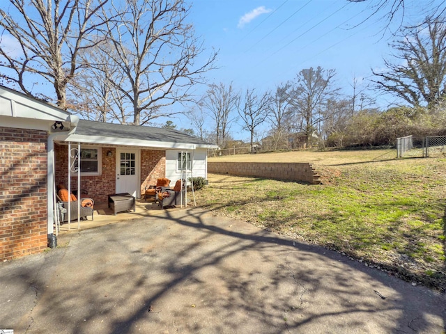 view of yard with a patio and fence