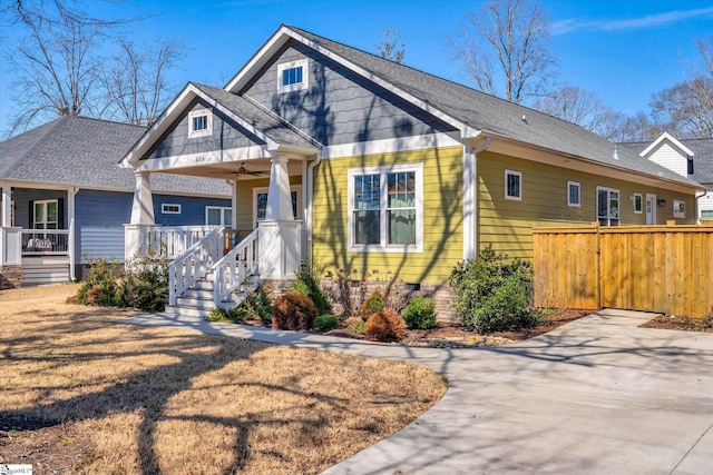 craftsman house featuring covered porch, roof with shingles, and ceiling fan