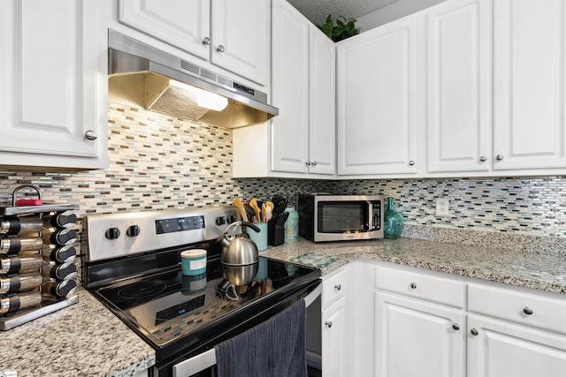 kitchen featuring under cabinet range hood, white cabinetry, range with electric cooktop, and stainless steel microwave