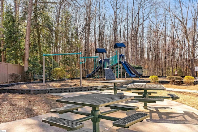 communal playground featuring fence