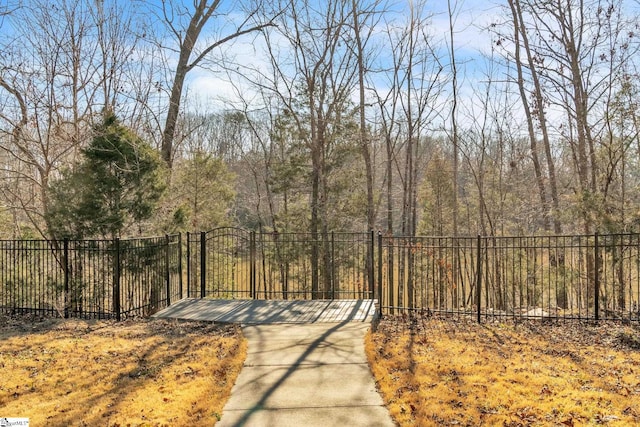 view of gate featuring fence