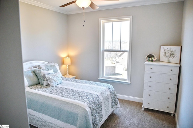 bedroom with a ceiling fan, crown molding, baseboards, and carpet flooring