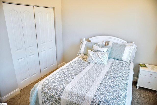 bedroom featuring carpet floors, a closet, and baseboards