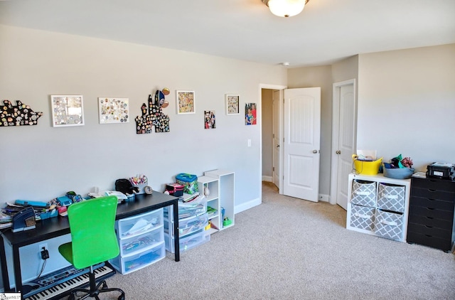 carpeted home office with baseboards