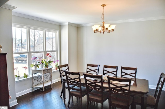 dining space featuring a notable chandelier, baseboards, ornamental molding, and dark wood-type flooring