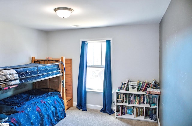 bedroom featuring carpet, visible vents, and baseboards