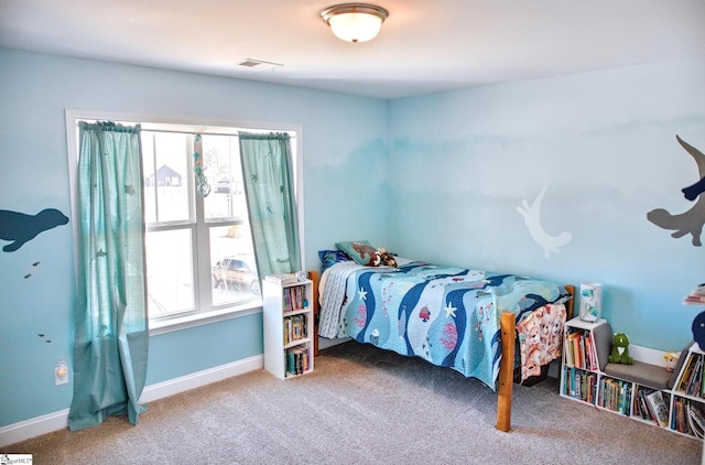 bedroom featuring baseboards, visible vents, and carpet flooring