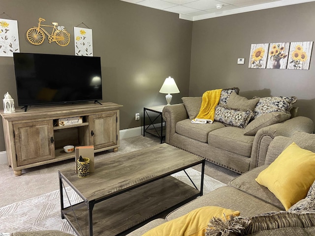 living room featuring baseboards and light colored carpet