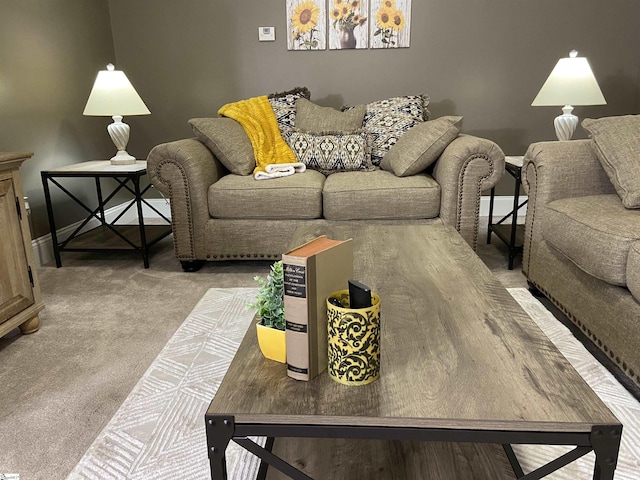 carpeted living room featuring baseboards