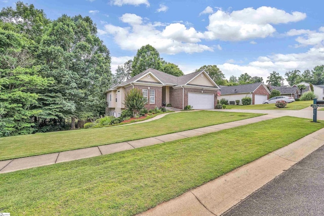 ranch-style house with a garage, a front yard, brick siding, and driveway