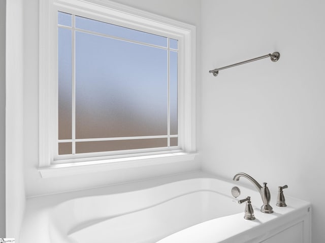 full bathroom with a healthy amount of sunlight and a garden tub