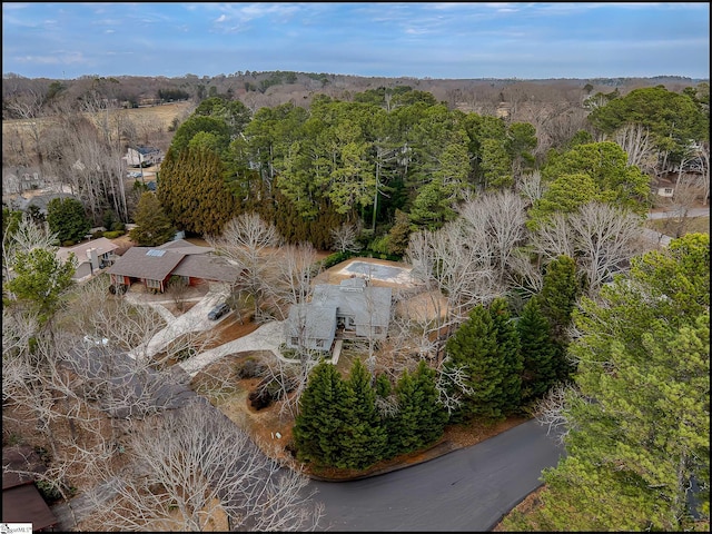 aerial view with a wooded view