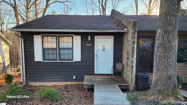 view of front of house with roof with shingles