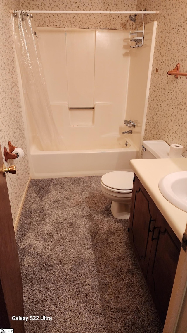 bathroom featuring shower / tub combo, vanity, toilet, and wallpapered walls