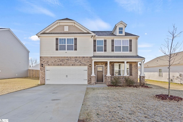 craftsman inspired home with covered porch, concrete driveway, brick siding, and an attached garage