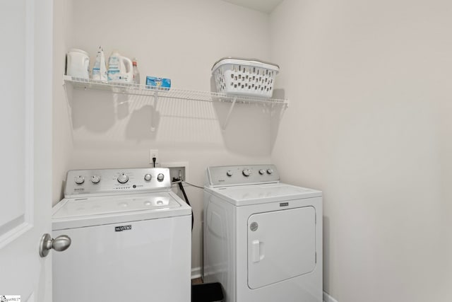 clothes washing area with laundry area and separate washer and dryer