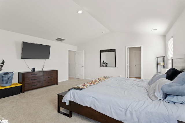 bedroom featuring light carpet, baseboards, visible vents, and lofted ceiling