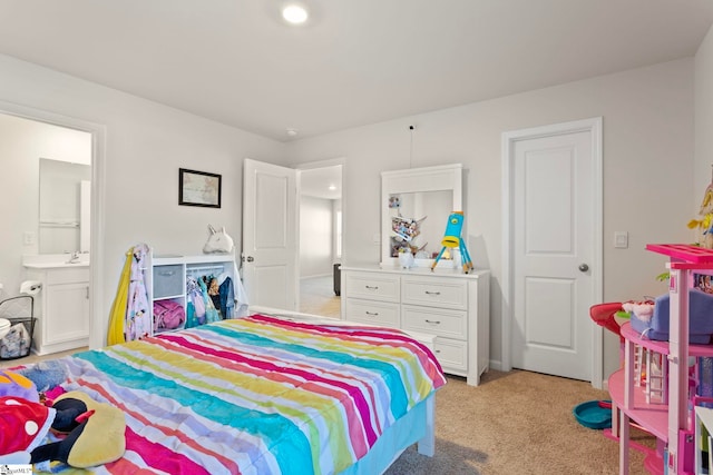 bedroom with light carpet, a sink, and connected bathroom