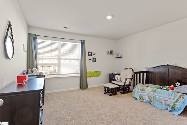 bedroom with carpet floors, visible vents, and baseboards