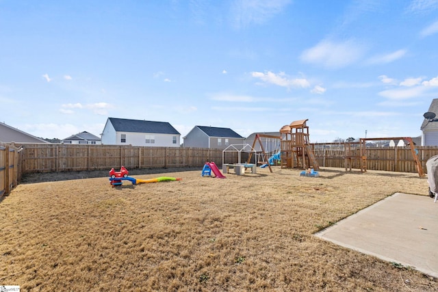 view of jungle gym featuring a fenced backyard and a lawn