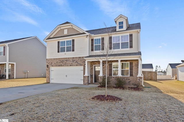 craftsman-style home with driveway, brick siding, an attached garage, and fence