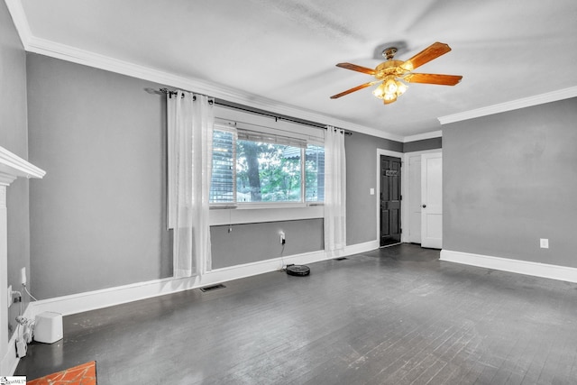 empty room featuring visible vents, baseboards, a ceiling fan, ornamental molding, and wood finished floors