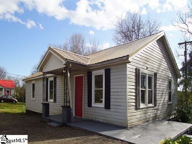 view of property exterior with metal roof