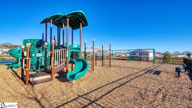 communal playground featuring fence